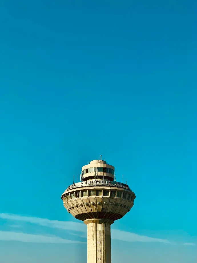 a tall tower with a clock on the top of it